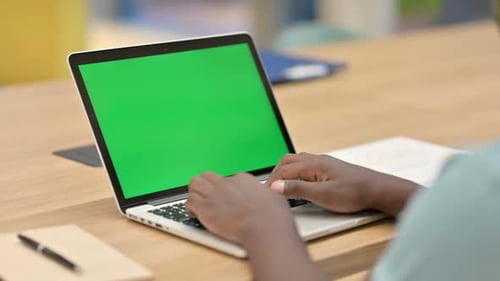Hands Typing on Laptop with Green Screen