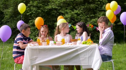 Happy Kids on Birthday Party at Summer Garden