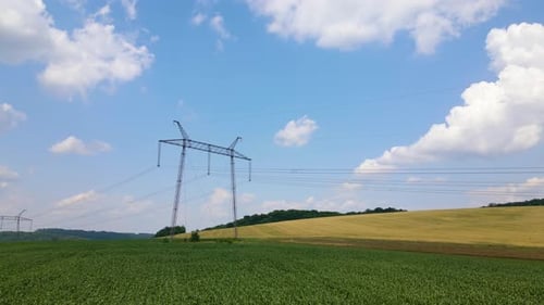 Tower with Electric Power Lines for Transfering High Voltage Electricity Located in Agricultural