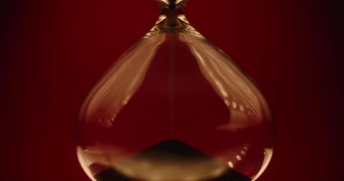 Hourglass with Black Sand Falling