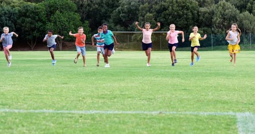 School kids running in playground