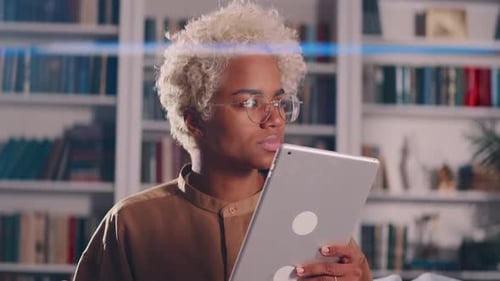 Person Uses Tablet Device Indoors