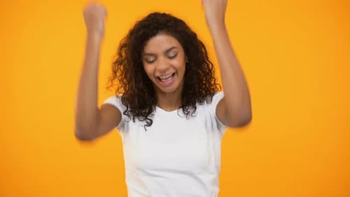 Smiling Black Girl Doing Success Gestures and Saying Yes at Camera, Happiness