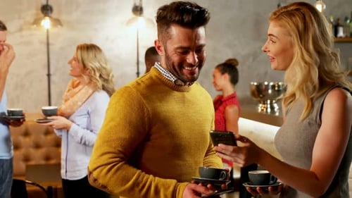 People Socializing and Drinking Coffee at Gathering