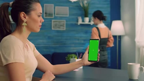 Business Woman Sitting on Office Table in Living Room Using Modern Phone