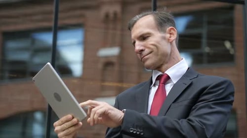 Businessman Using Tablet