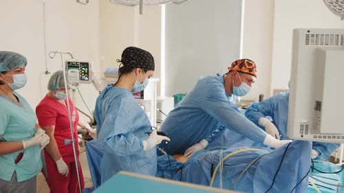 Surgeons Performing Operation in Hospital Operating Room