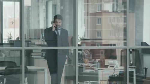 Male Lawyer Making Phone Call in Office