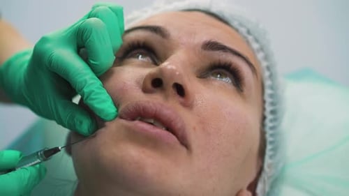 Woman Undergoes Anti-aging Facial Filler Injection in Clinic