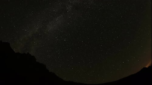 Night Sky with Stars and Mountain Silhouettes