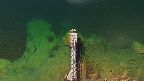 Aerial Top View of Wooden Little Bridge in Mountain Lake in Autumn