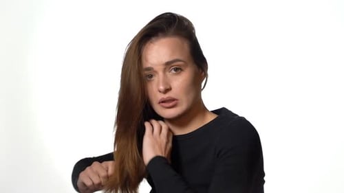 Everyday routine for every woman. Portrait of beautiful young woman combing her hair