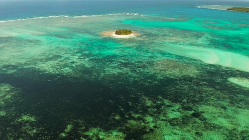 Tropical Guyam Island with a Sandy Beach and Tourists