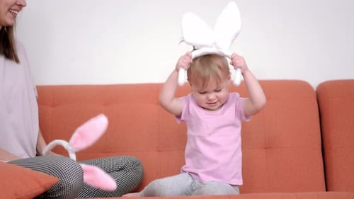 Happy Easter Joyful Family Mom and Daughter Preparing Easter Putting on Rabbit Bunny Ears Headbands