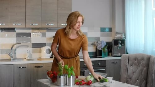 Woman Prepares Fresh Vegetables in Modern Kitchen