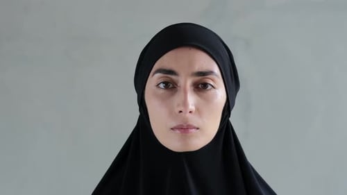 Young Woman Wearing a Black Head Covering