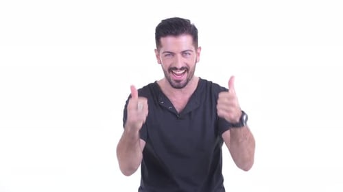 Enthusiastic Young Adult Man Giving Thumbs Up