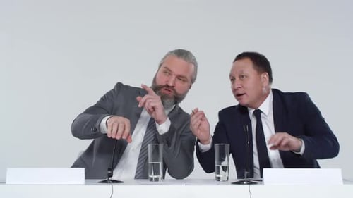 Businessmen Talking at Press Conference