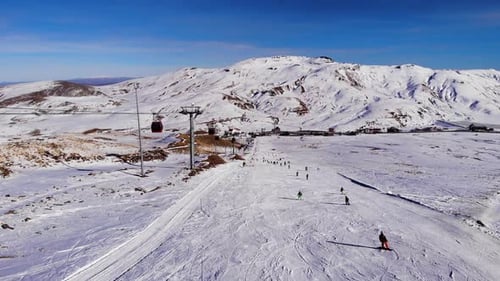 Skiers and Snowboarders on Snow Covered Mountain