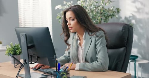 Heartbroken Sad Upset Office Worker Sits in Front of Computer Checks Bad News Large Amount of Work