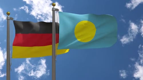 Flags of Germany and Palau Waving against Blue Sky