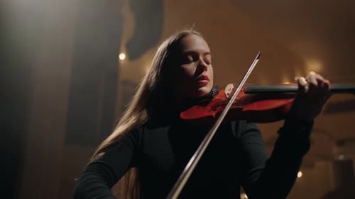 Woman with Violin Performing Beautiful Music