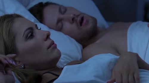 Couple Sleeping in Bed, Displeased Wife Awakened by Loud Snore of Husband