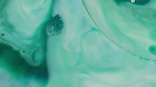 Abstract Turquoise and Green Liquid Mixing
