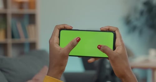 Woman Texting on Smartphone with Green Empty Screen