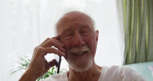 Senior Man Talking on Cell Phone, Smiling