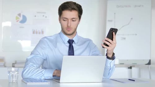 Young Adult Using Technology at Workplace