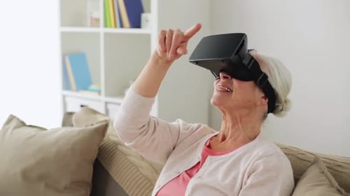 Senior Woman Exploring Virtual Reality at Home