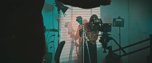 A filmmaker and the actress preparing the film studio