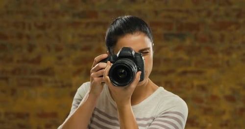 Young woman taking photo