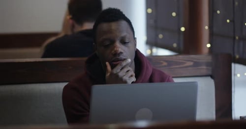 Young Man Reading Bad News