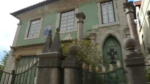 Vehicle Moving Fast Down Residential Road and Passing by Old Beautiful Mansion