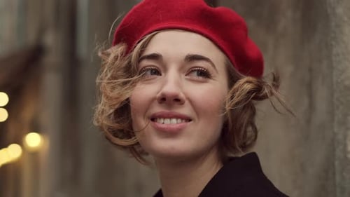 Smiling Woman with Red Beret on City Street