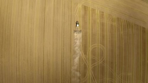 Tractor plows the field aerial.