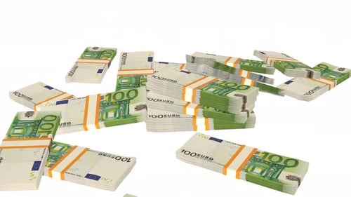 Many wads of money falling on table. 100 Euro banknotes.
