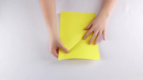 Hands Make Origami. White. Time Lapse