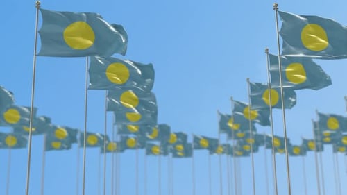 Many Waving Blue and Yellow Flags Against a Clear Sky