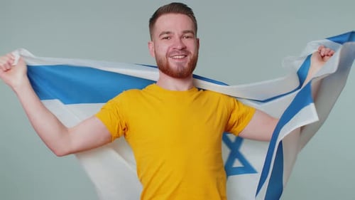 Smiling Young Adult Holds a Flag