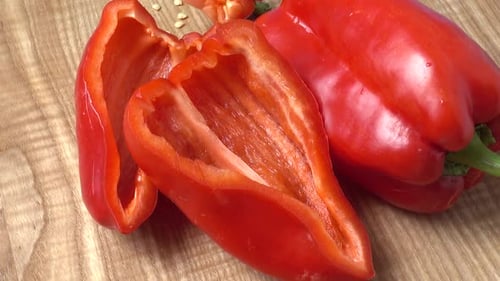 Red Bell Pepper on a Wooden Cutting Board