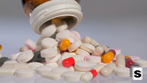 Pills Poured from Prescription Bottle Macro