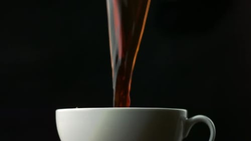 Dramatic Pour Into Cup Creates a Splash