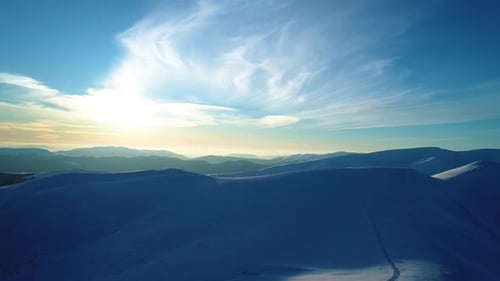 Snowy Mountain Peaks at Golden Hour, Aerial View