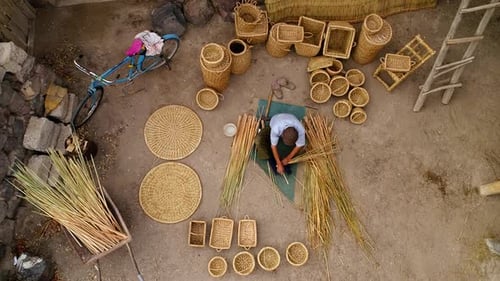 Man Weaving A Basket