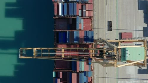 Aerial View. International Port with Crane Loading Containers in Import Export Business Logistics.
