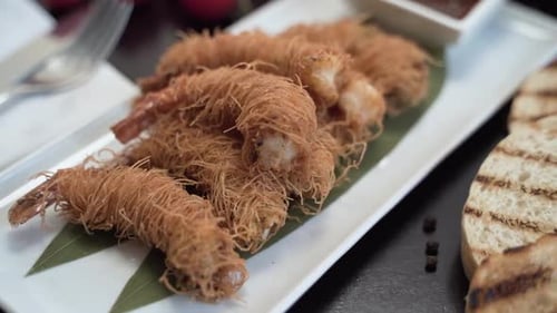 Close-up, baked shrimp on white plate