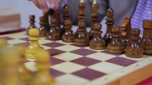 Chess Game Playing and Strategy on Wooden Board
